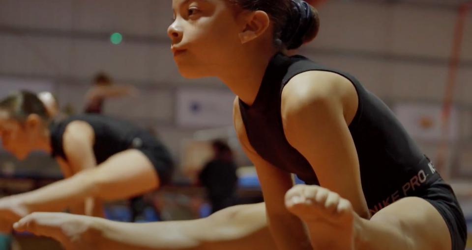 A girl performing a V-lift