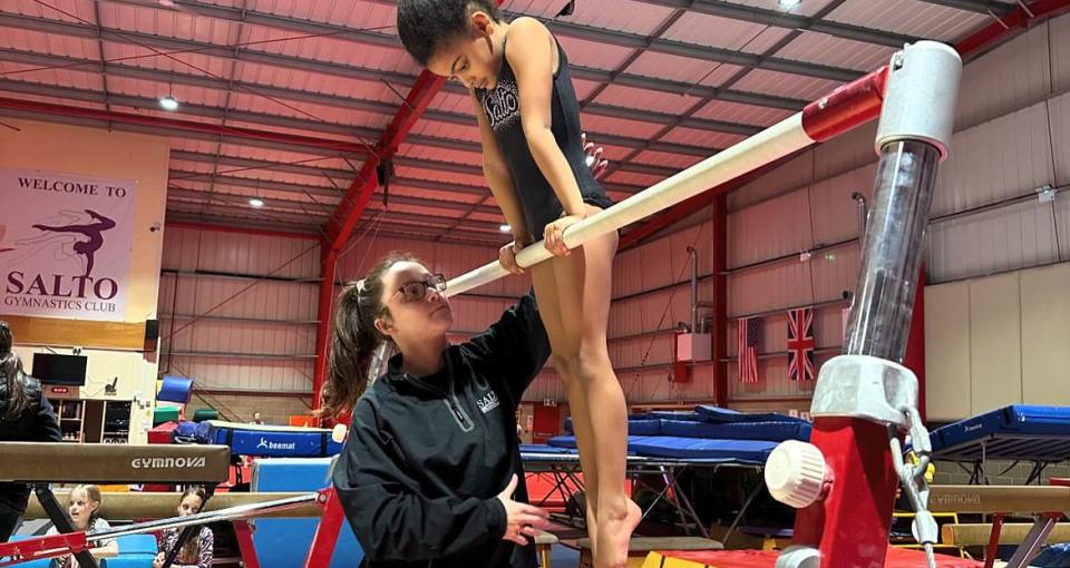 gymnast on bar 