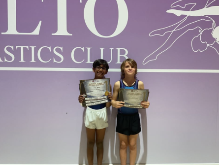 boys holding certificates