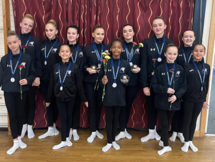 gymnasts holding roses