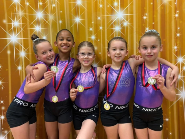 Five Gymnasts with medals