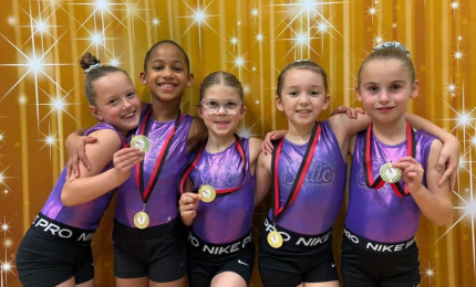 Five Gymnasts with medals