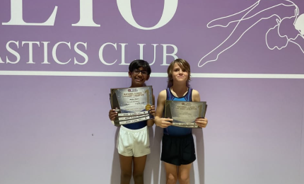 boys holding certificates