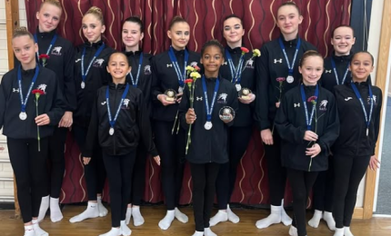 gymnasts holding roses